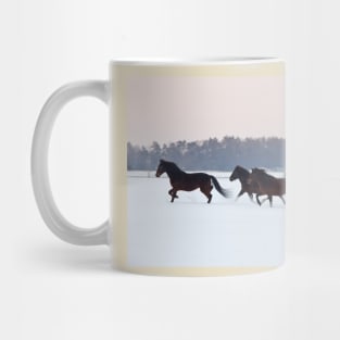 Four horses galloping on snowy paddock Mug